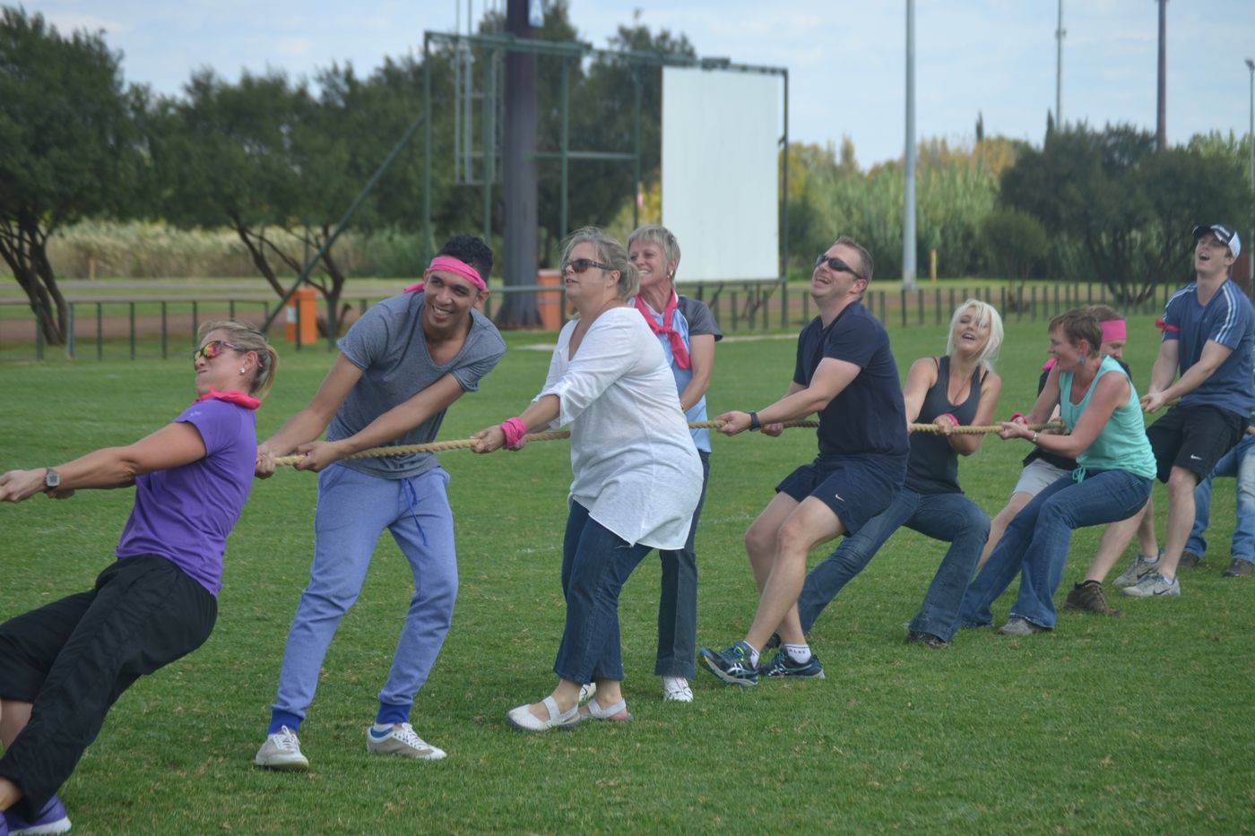 Teams in an outdoor tug of war challenge