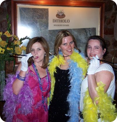 three women posing in fancy dress